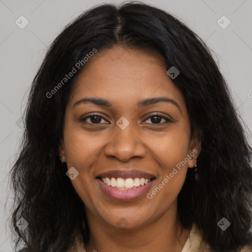 Joyful black young-adult female with long  brown hair and brown eyes