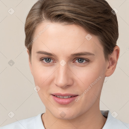 Joyful white young-adult female with short  brown hair and grey eyes