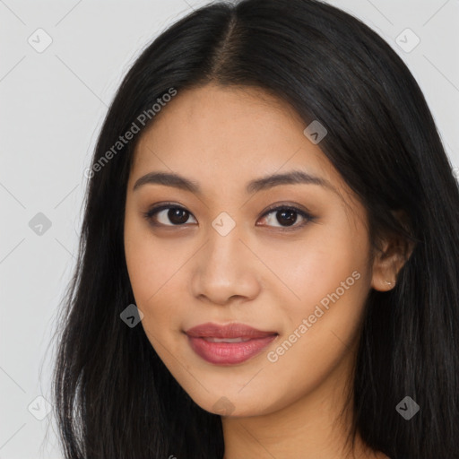 Joyful asian young-adult female with long  brown hair and brown eyes