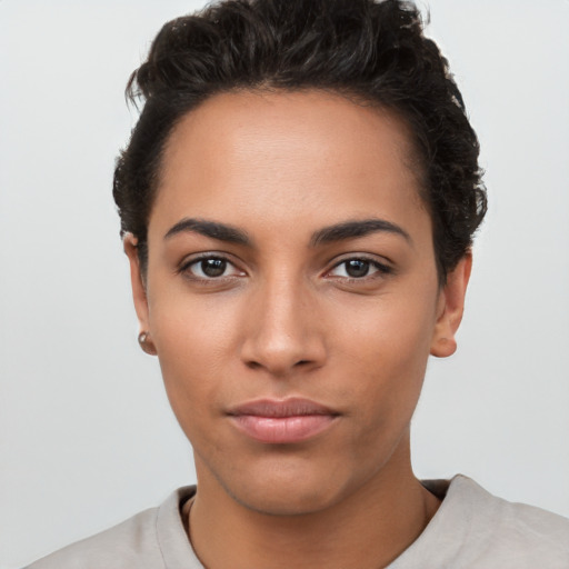 Neutral latino young-adult female with short  black hair and brown eyes