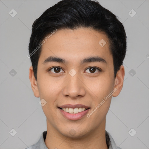 Joyful asian young-adult male with short  black hair and brown eyes