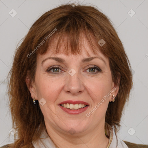 Joyful white adult female with medium  brown hair and grey eyes