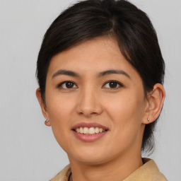 Joyful asian young-adult female with short  brown hair and brown eyes