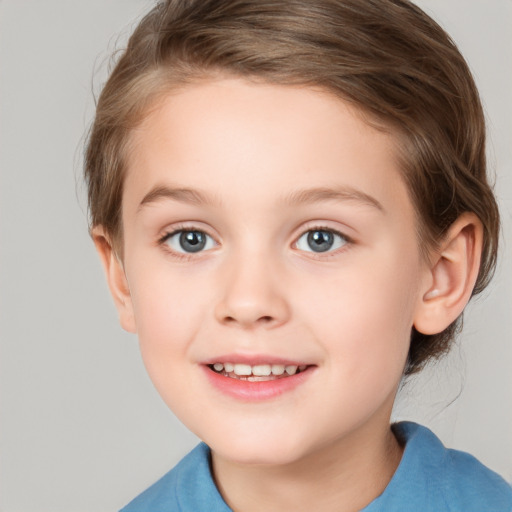 Joyful white child female with medium  brown hair and blue eyes