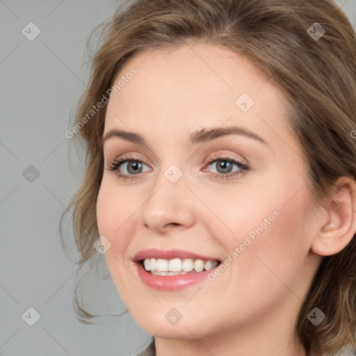 Joyful white young-adult female with medium  brown hair and blue eyes