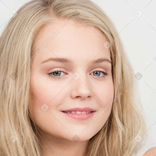 Joyful white young-adult female with long  brown hair and blue eyes