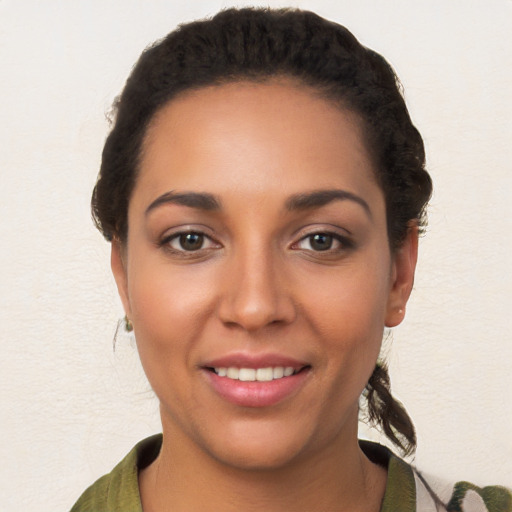 Joyful white young-adult female with long  brown hair and brown eyes