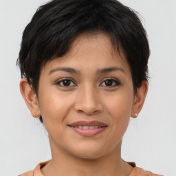 Joyful asian young-adult female with short  brown hair and brown eyes