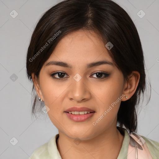 Joyful latino young-adult female with medium  brown hair and brown eyes