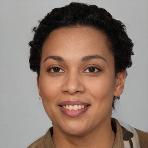 Joyful latino young-adult female with short  brown hair and brown eyes