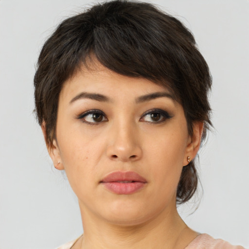 Neutral asian young-adult female with medium  brown hair and brown eyes