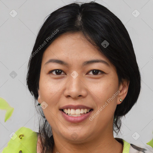 Joyful asian young-adult female with medium  black hair and brown eyes