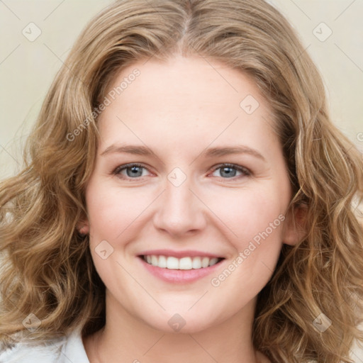 Joyful white young-adult female with medium  brown hair and blue eyes