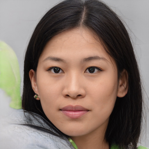 Joyful asian young-adult female with medium  black hair and brown eyes