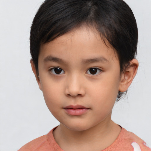 Neutral asian child female with short  brown hair and brown eyes