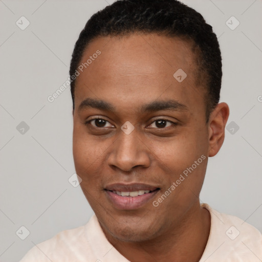 Joyful black young-adult male with short  black hair and brown eyes