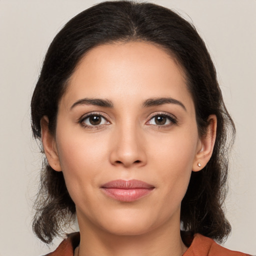 Joyful white young-adult female with medium  brown hair and brown eyes