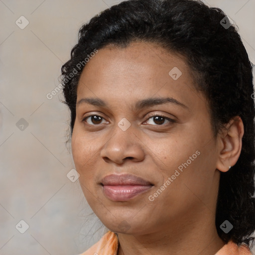 Joyful black young-adult female with long  brown hair and brown eyes