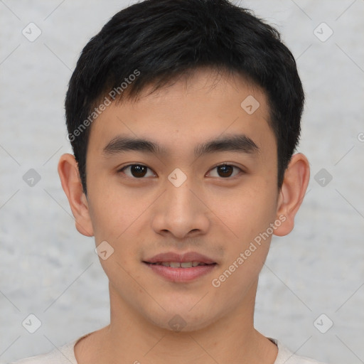 Joyful asian young-adult male with short  black hair and brown eyes