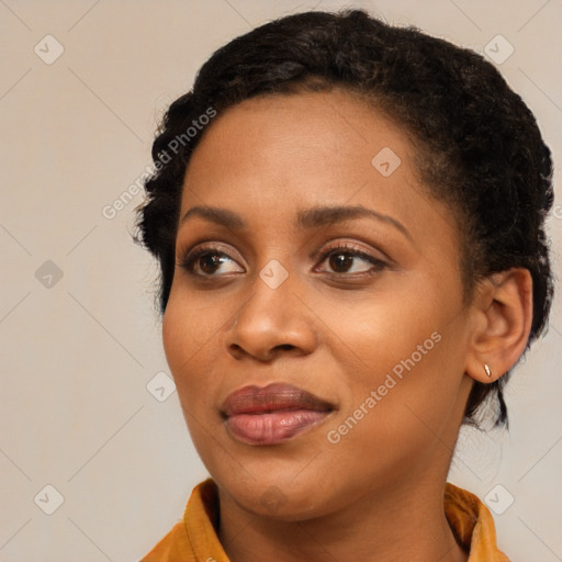 Joyful black young-adult female with medium  black hair and brown eyes