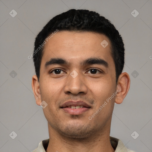 Joyful latino young-adult male with short  black hair and brown eyes