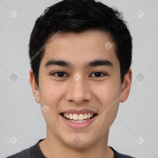 Joyful white young-adult male with short  black hair and brown eyes