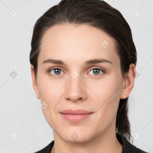 Joyful white young-adult female with medium  brown hair and grey eyes