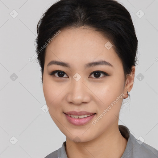 Joyful asian young-adult female with medium  black hair and brown eyes