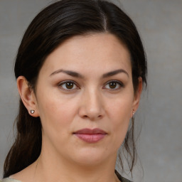 Joyful white young-adult female with medium  brown hair and brown eyes