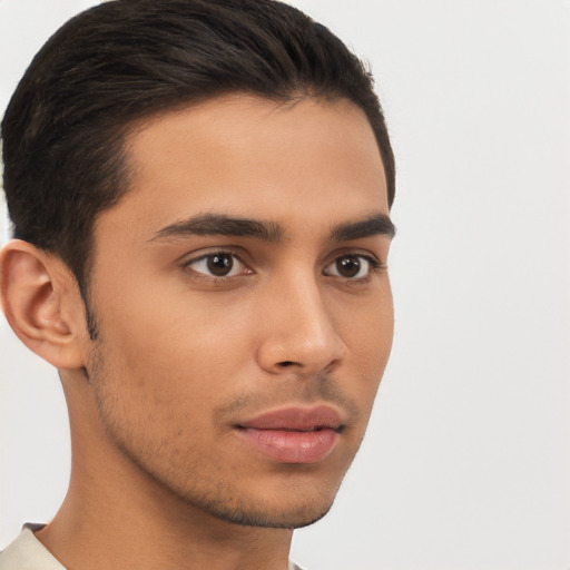 Neutral latino young-adult male with short  brown hair and brown eyes