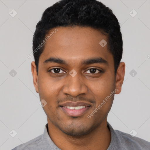 Joyful black young-adult male with short  black hair and brown eyes