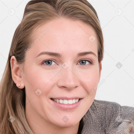 Joyful white young-adult female with long  brown hair and blue eyes