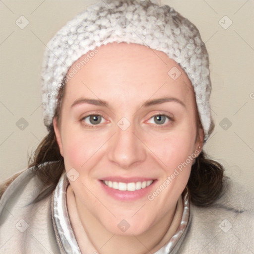 Joyful white young-adult female with medium  brown hair and blue eyes