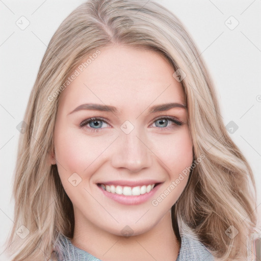 Joyful white young-adult female with long  brown hair and blue eyes