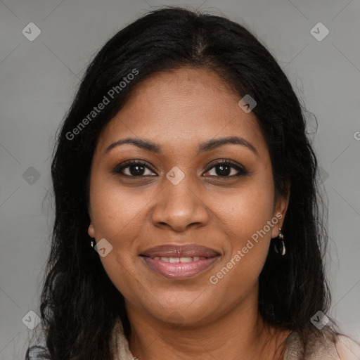 Joyful black young-adult female with long  brown hair and brown eyes