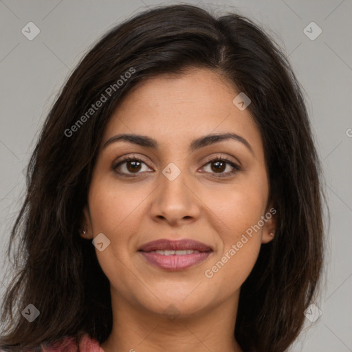 Joyful latino young-adult female with long  brown hair and brown eyes