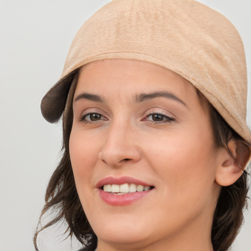 Joyful white young-adult female with medium  brown hair and brown eyes