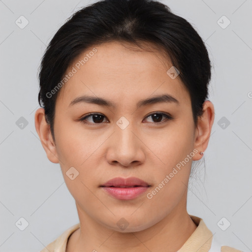 Joyful asian young-adult female with short  brown hair and brown eyes