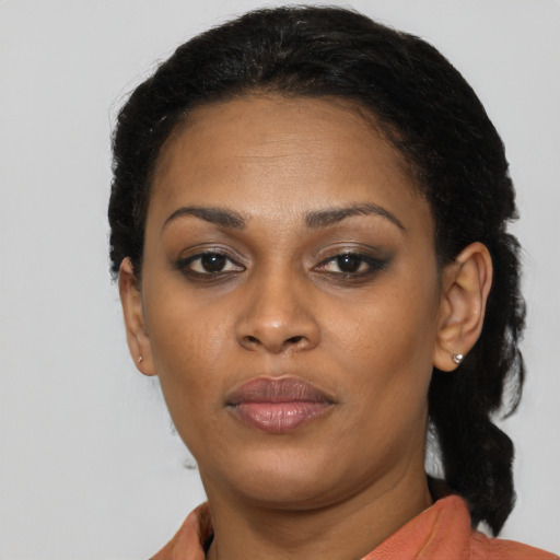 Neutral black adult female with short  black hair and brown eyes