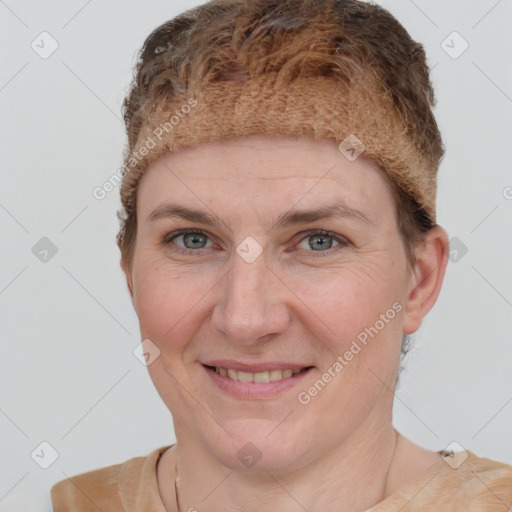 Joyful white young-adult female with short  brown hair and grey eyes