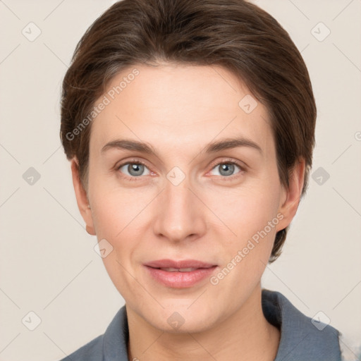 Joyful white young-adult female with short  brown hair and grey eyes