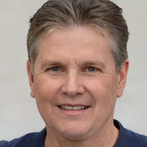 Joyful white middle-aged male with short  brown hair and brown eyes