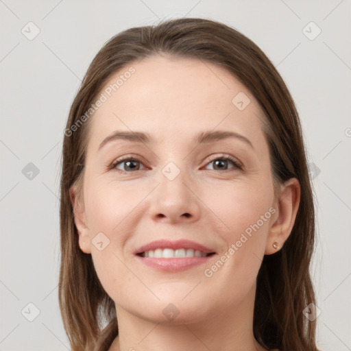 Joyful white young-adult female with long  brown hair and grey eyes