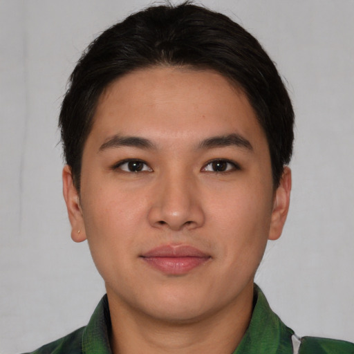 Joyful asian young-adult male with short  brown hair and brown eyes