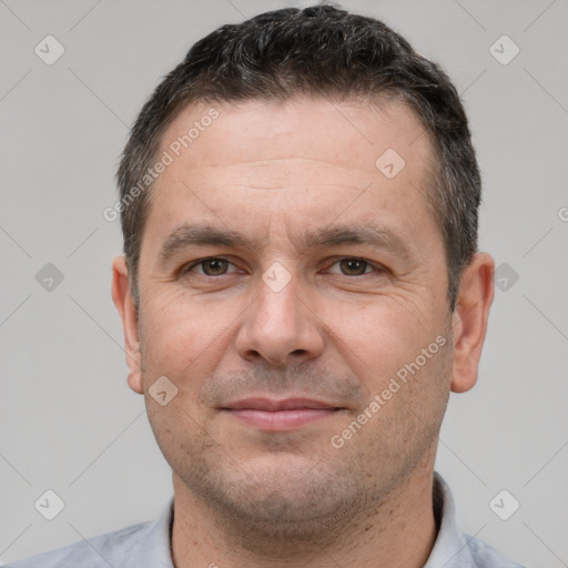 Joyful white adult male with short  brown hair and brown eyes