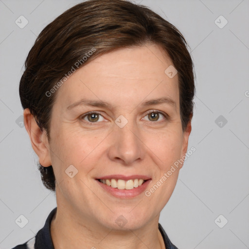 Joyful white adult female with short  brown hair and grey eyes