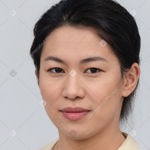 Joyful asian young-adult female with medium  brown hair and brown eyes