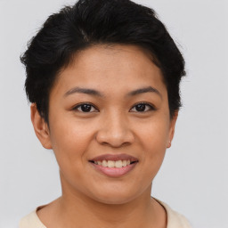 Joyful asian young-adult female with short  brown hair and brown eyes