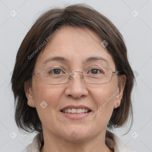 Joyful white adult female with medium  brown hair and grey eyes