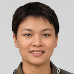 Joyful asian young-adult female with short  brown hair and brown eyes